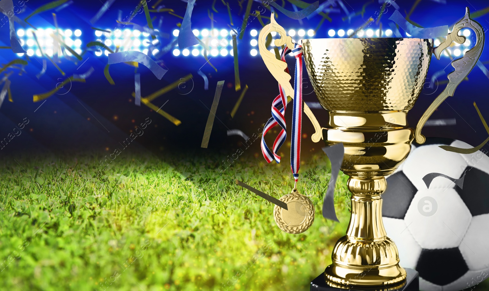Football championship. Shiny golden trophy cup with medal and soccer ball under falling confetti on stadium, banner design Image of Football championship. Shiny golden trophy cup with medal and soccer ball under falling confetti on stadium, banner design