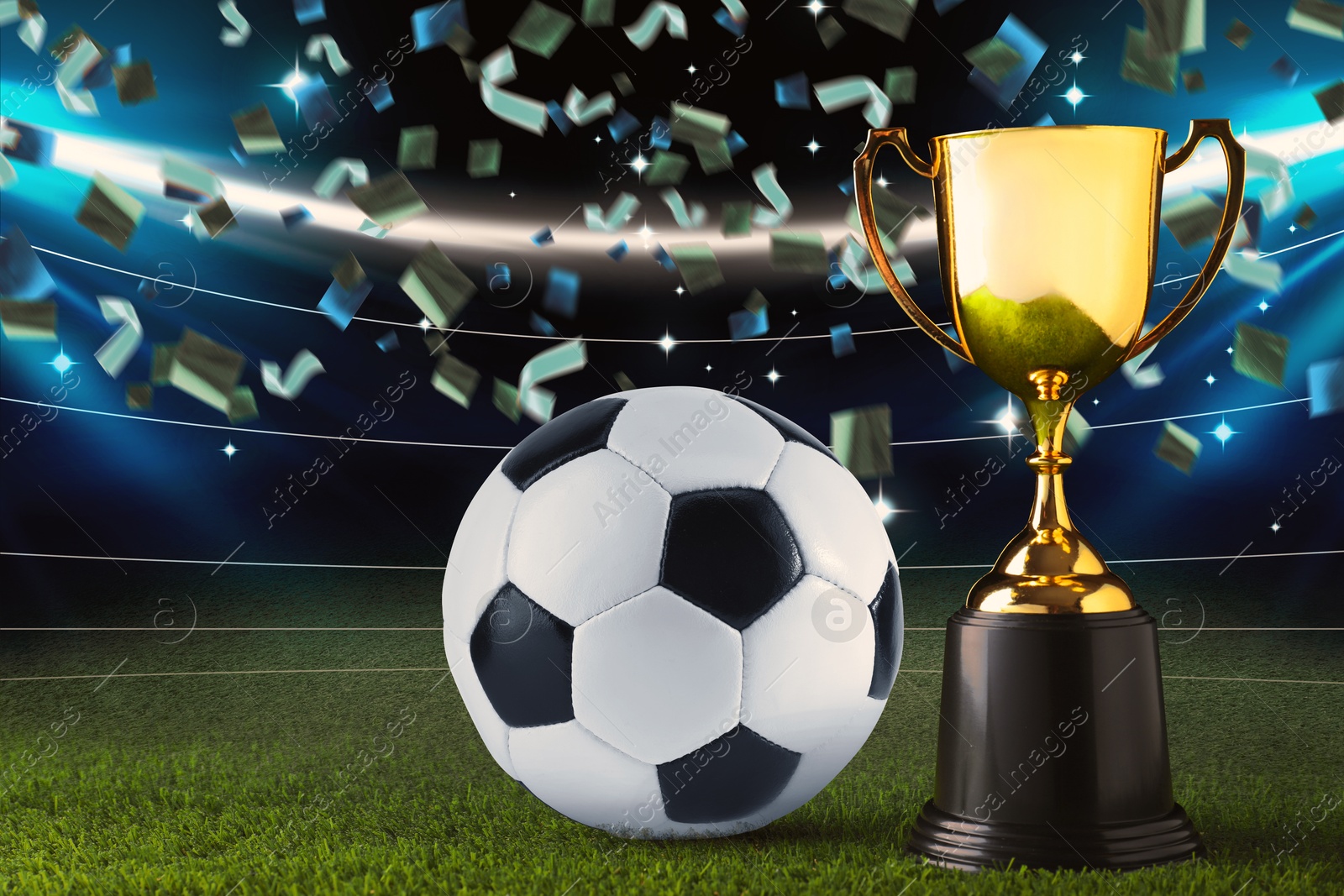 Football championship. Shiny golden trophy cup and soccer ball under falling confetti on stadium Image of Football championship. Shiny golden trophy cup and soccer ball under falling confetti on stadium