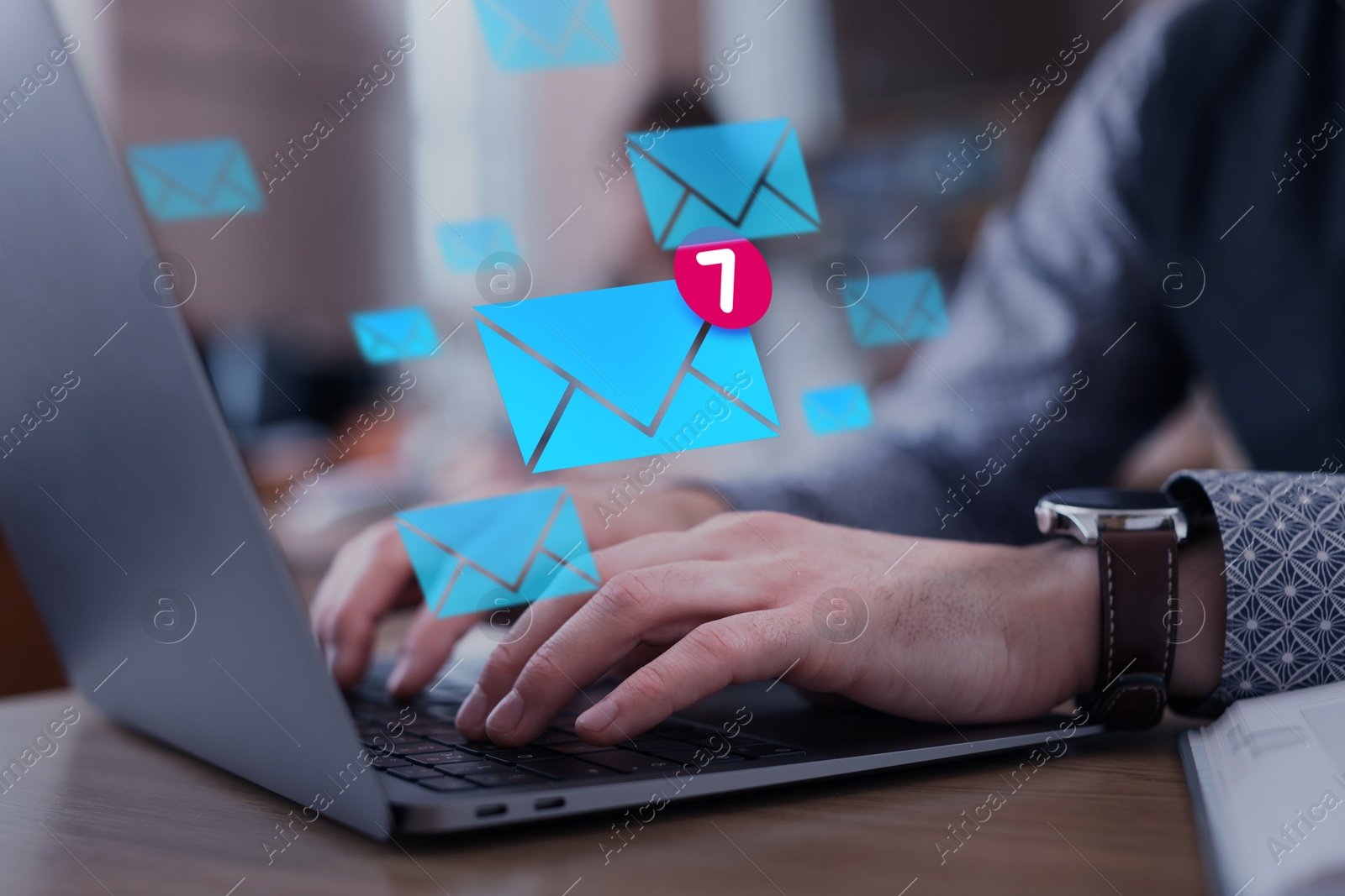 Email marketing, new message notification. Man using laptop at table, closeup. Envelopes flying out of computer Image of Email marketing, new message notification. Man using laptop at table, closeup. Envelopes flying out of computer