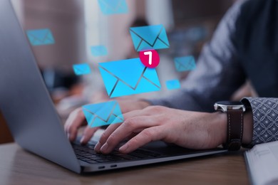 Image of Email marketing, new message notification. Man using laptop at table, closeup. Envelopes flying out of computer