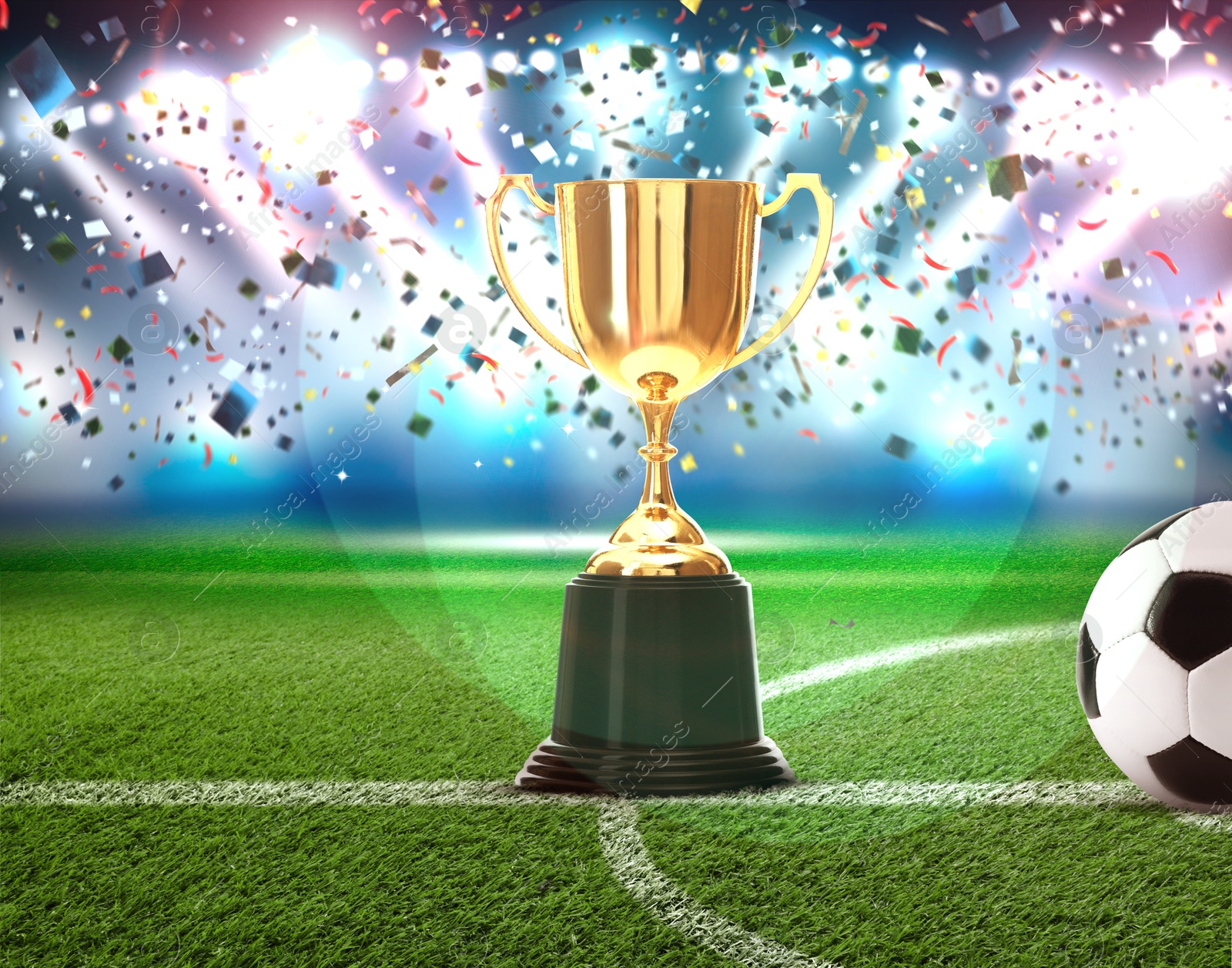 Football championship. Shiny golden trophy cup and soccer ball under falling confetti on stadium Image of Football championship. Shiny golden trophy cup and soccer ball under falling confetti on stadium