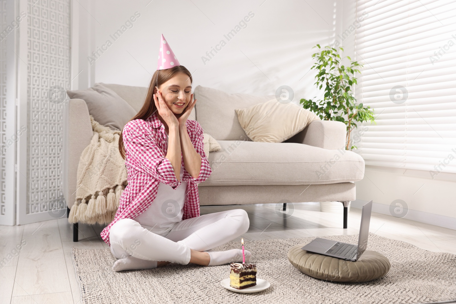 Birthday celebration. Happy woman with piece of cake having video call via laptop at home Photo of Birthday celebration. Happy woman with piece of cake having video call via laptop at home