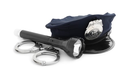 Photo of Police cap, flashlight and handcuffs on white background