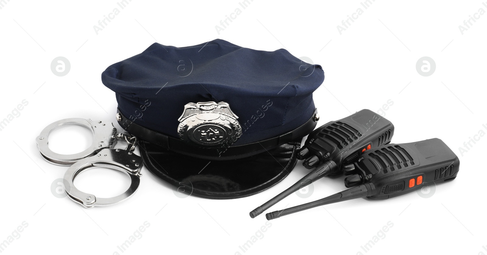 Police cap, walkie talkies and handcuffs on white background Photo of Police cap, walkie talkies and handcuffs on white background