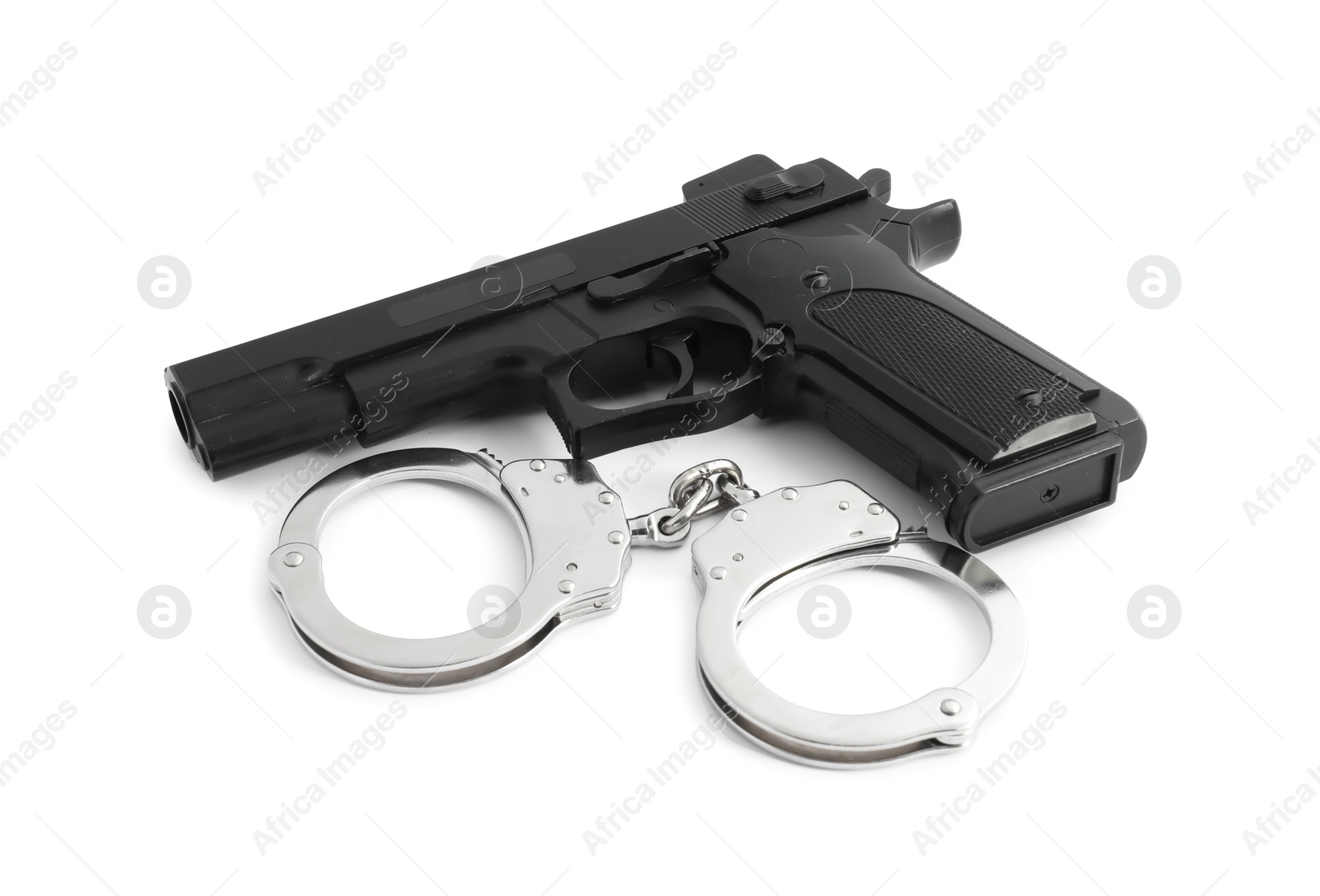 Gun and handcuffs on white background. Police equipment Photo of Gun and handcuffs on white background. Police equipment