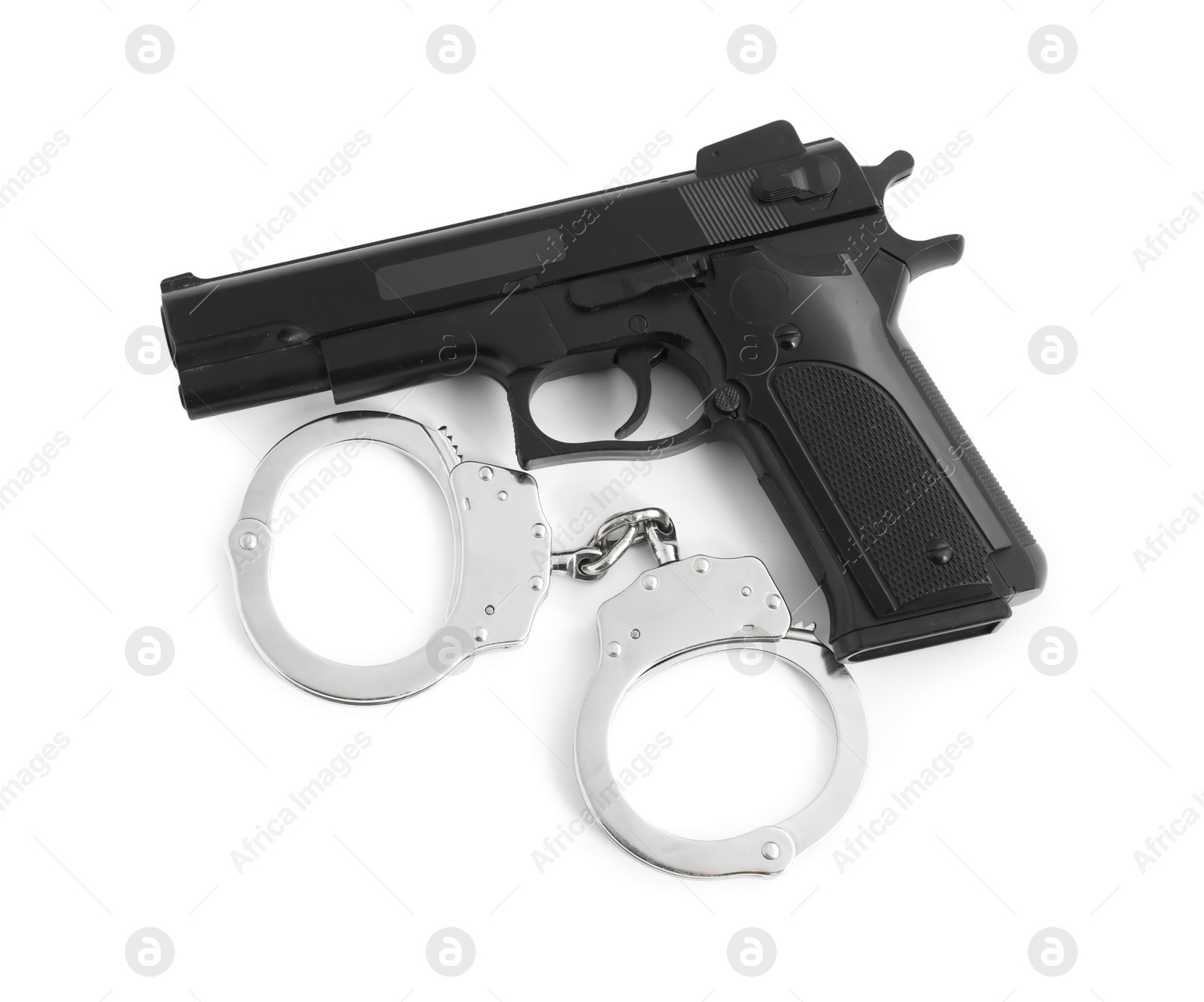 Gun and handcuffs on white background, top view. Police equipment Photo of Gun and handcuffs on white background, top view. Police equipment