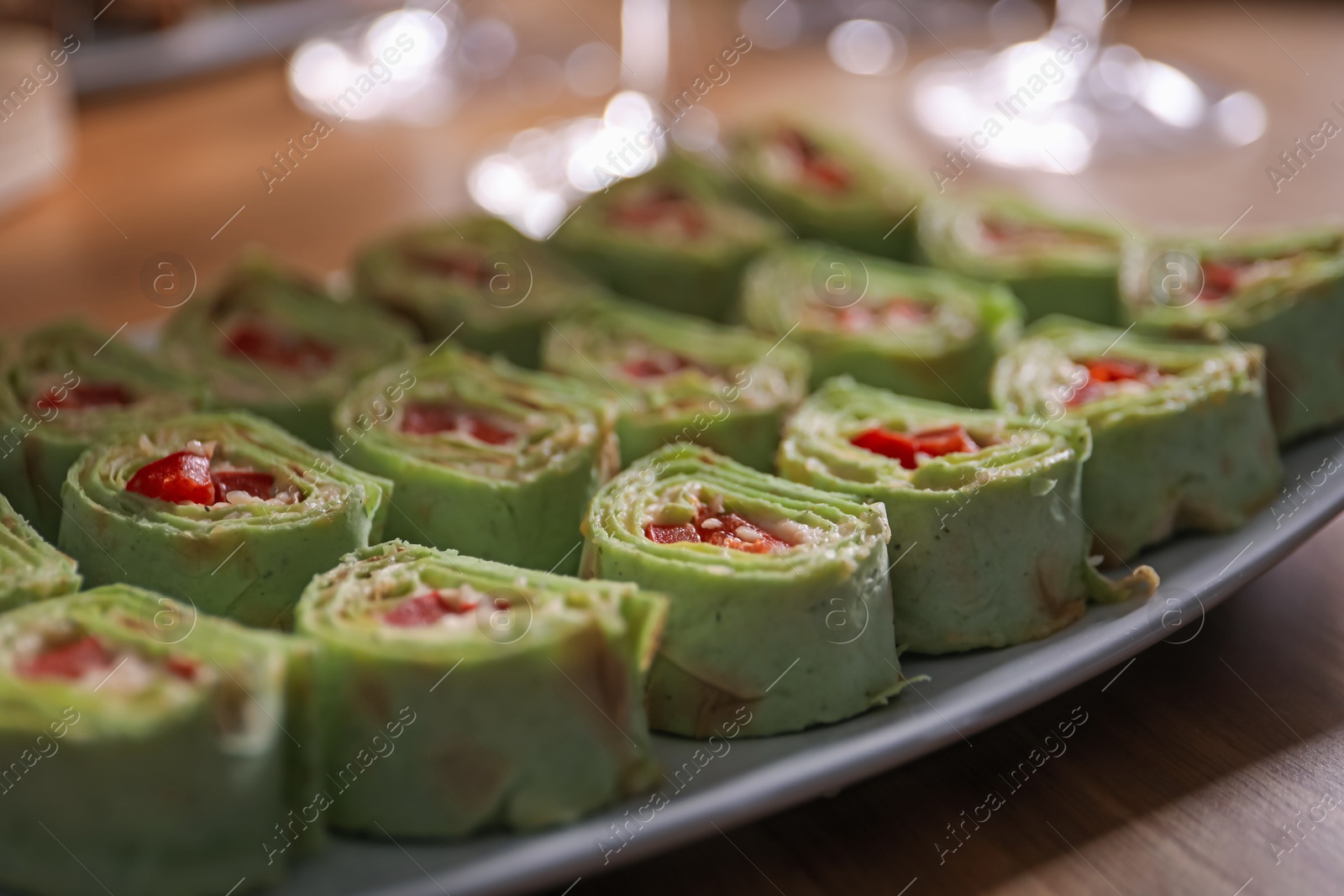 Buffet menu. Tasty rolls on wooden table, closeup Photo of Buffet menu. Tasty rolls on wooden table, closeup