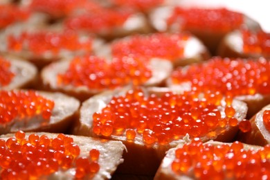 Photo of Buffet menu. Sandwiches with red caviar on table, closeup
