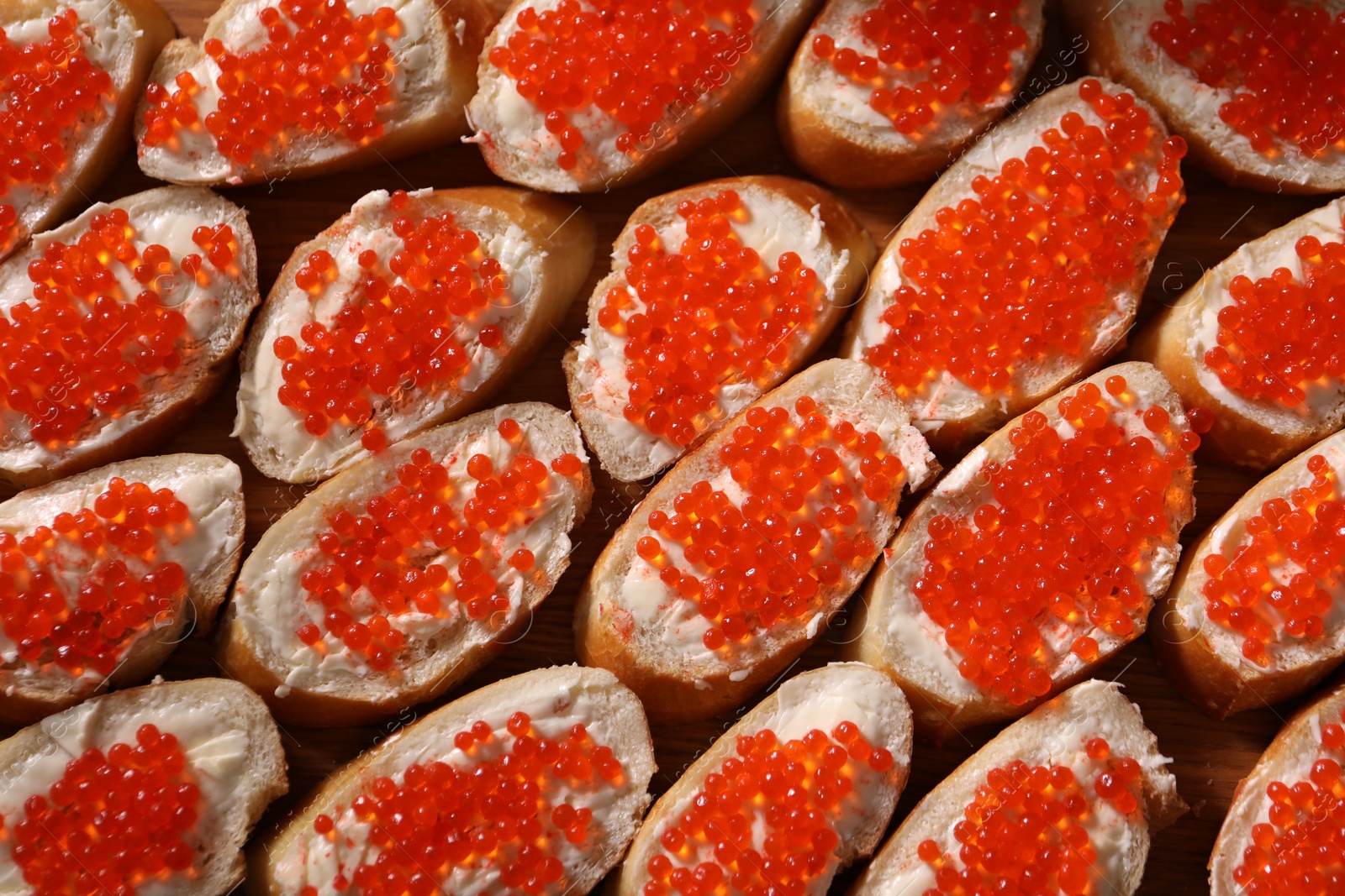 Buffet menu. Sandwiches with red caviar on table, top view Photo of Buffet menu. Sandwiches with red caviar on table, top view