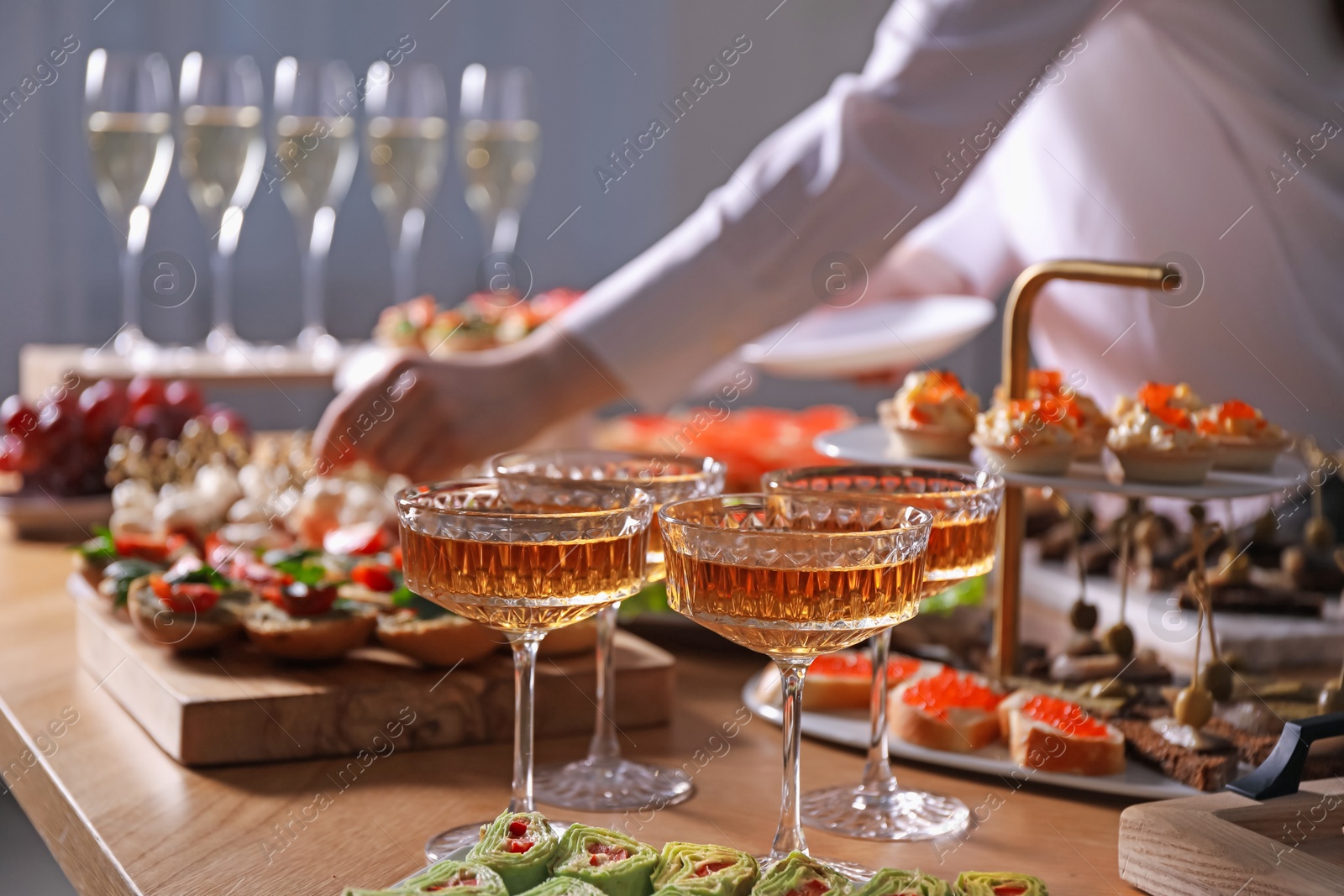 Buffet menu. Woman taking tasty canape from table, closeup Photo of Buffet menu. Woman taking tasty canape from table, closeup