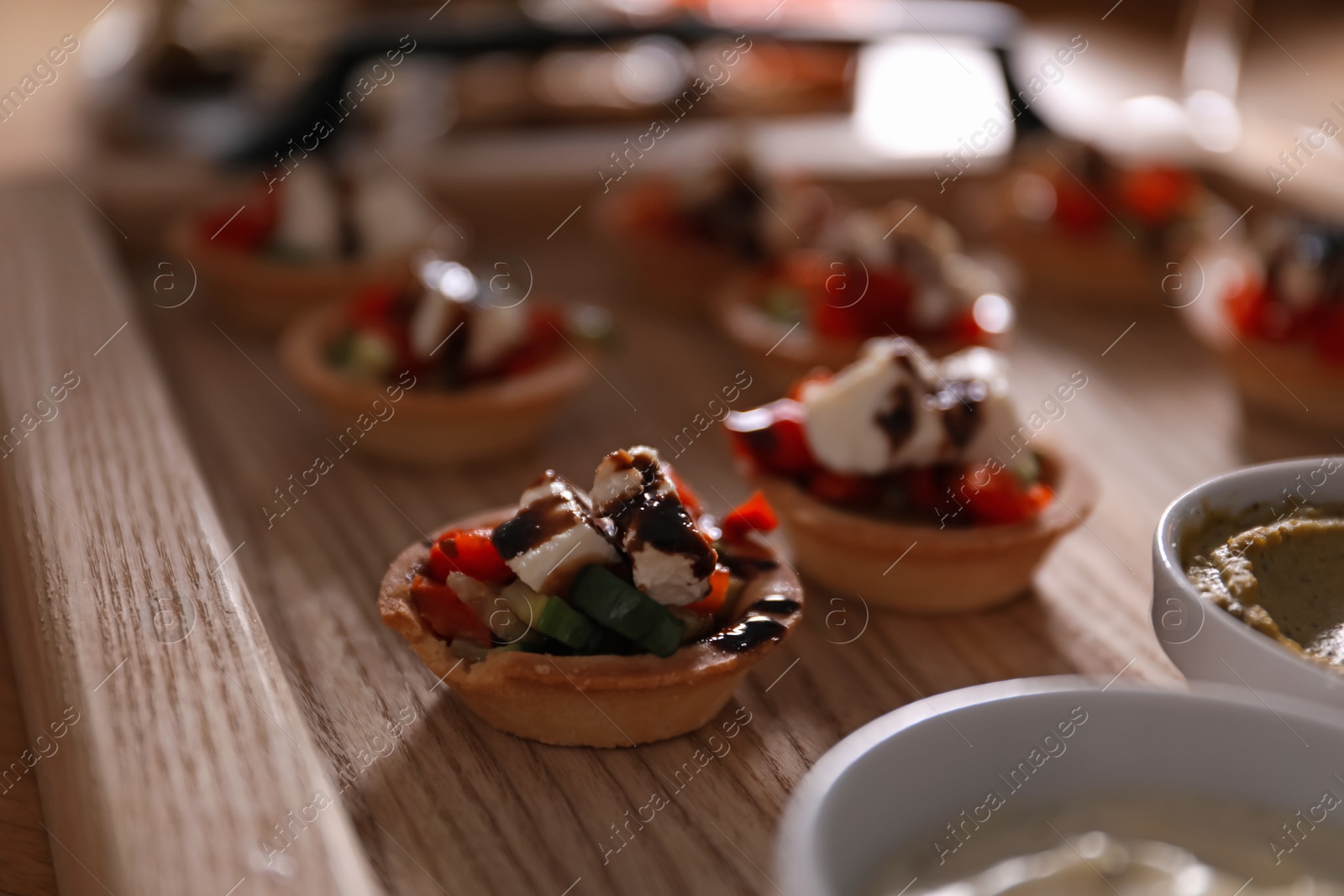 Buffet menu. Tasty stuffed tartlets on table, closeup Photo of Buffet menu. Tasty stuffed tartlets on table, closeup
