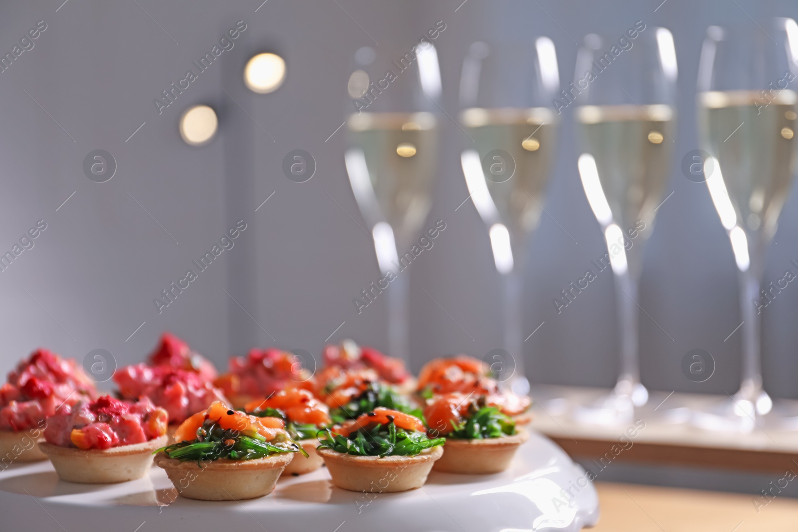 Buffet menu. Tasty stuffed tartlets on stand, closeup Photo of Buffet menu. Tasty stuffed tartlets on stand, closeup