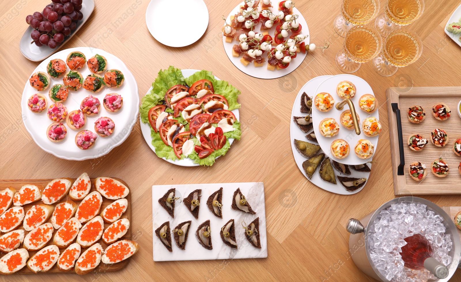 Buffet menu. Many different appetizers on wooden table, flat lay Photo of Buffet menu. Many different appetizers on wooden table, flat lay