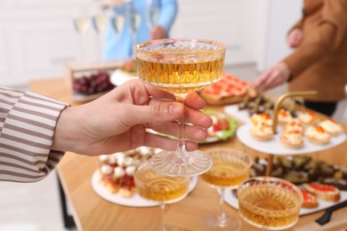 Photo of People with different appetizers at buffet, selective focus
