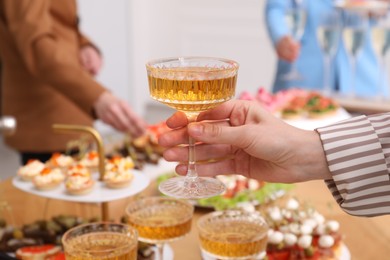 Photo of People with different appetizers at buffet, selective focus