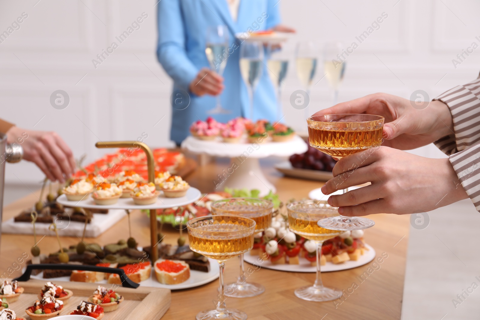 People with different appetizers at buffet, selective focus Photo of People with different appetizers at buffet, selective focus