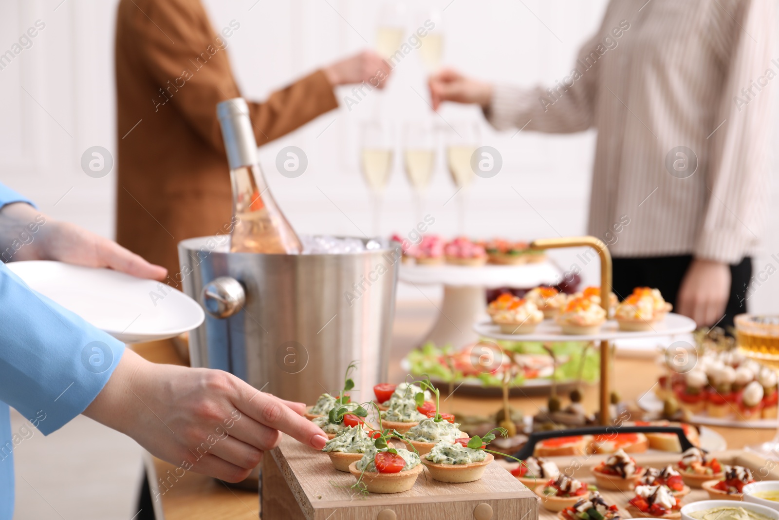 People with different appetizers at buffet, selective focus Photo of People with different appetizers at buffet, selective focus