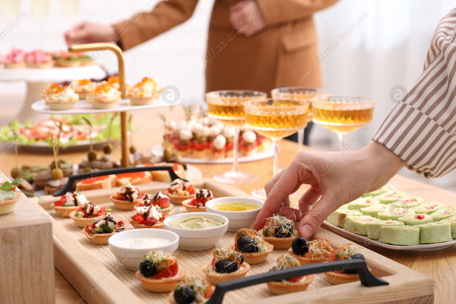 People with different appetizers at buffet, selective focus Photo of People with different appetizers at buffet, selective focus