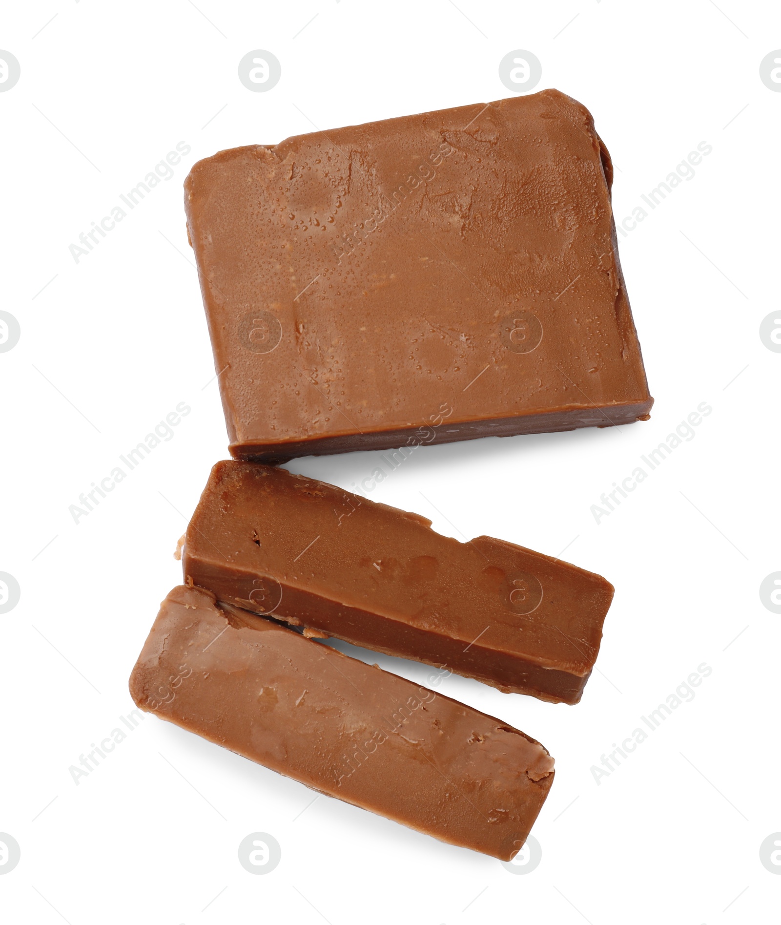 Pieces of tasty chocolate butter isolated on white, top view Photo of Pieces of tasty chocolate butter isolated on white, top view