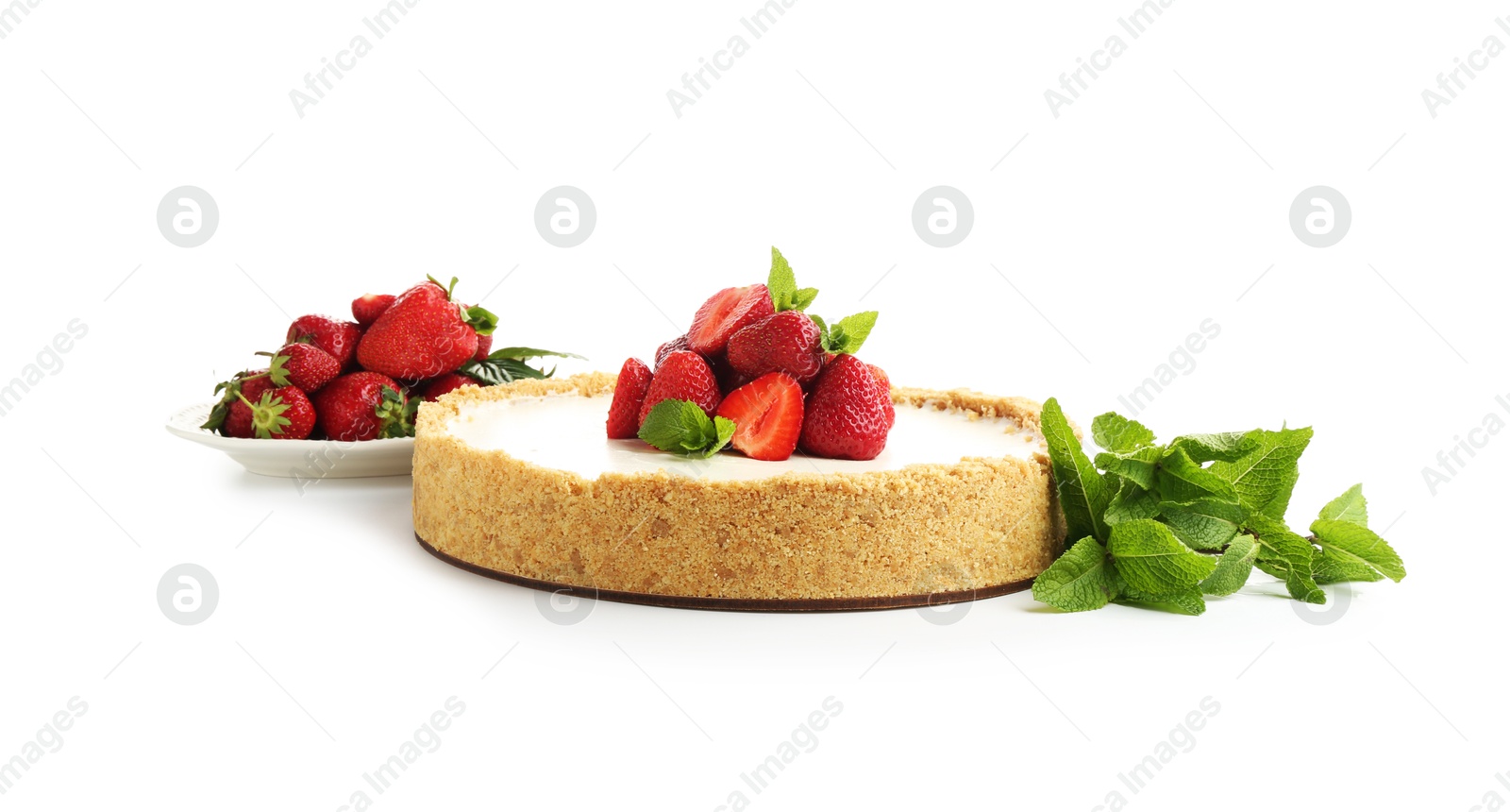 Tasty cheesecake with strawberries and mint isolated on white Photo of Tasty cheesecake with strawberries and mint isolated on white
