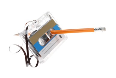 Photo of Rewinding audio cassette with pencil isolated on white