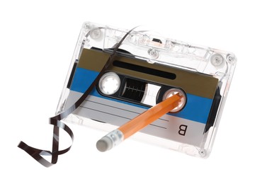 Photo of Rewinding audio cassette with pencil isolated on white