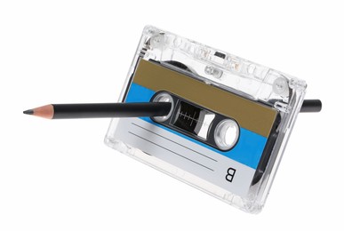 Photo of Rewinding audio cassette with pencil isolated on white