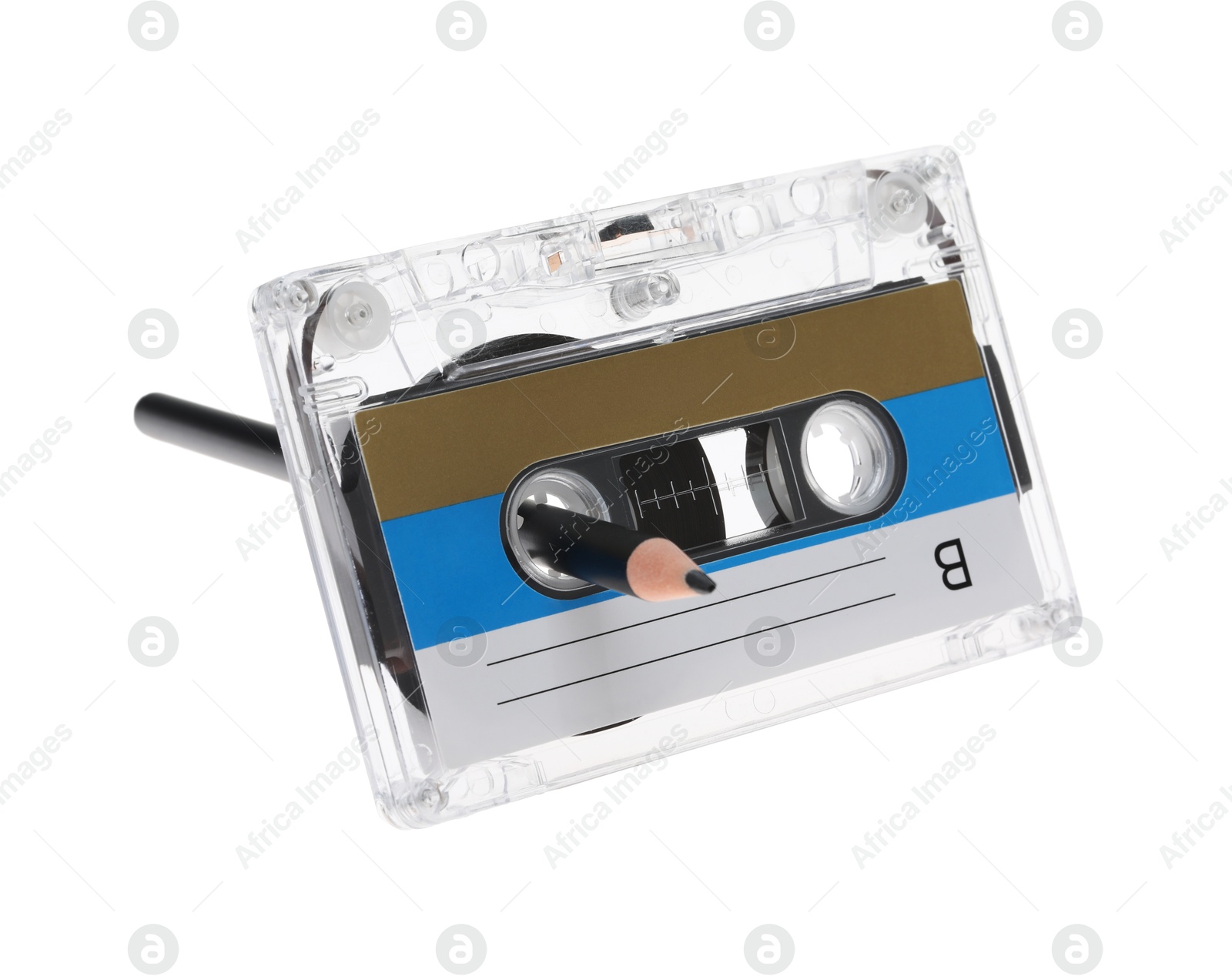 Rewinding audio cassette with pencil isolated on white Photo of Rewinding audio cassette with pencil isolated on white