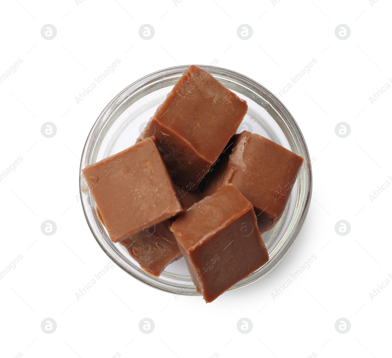 Tasty chocolate butter cubes in bowl isolated on white, top view Photo of Tasty chocolate butter cubes in bowl isolated on white, top view