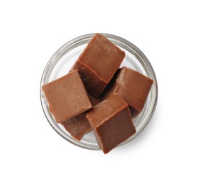 Photo of Tasty chocolate butter cubes in bowl isolated on white, top view