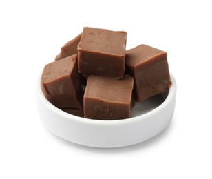 Photo of Tasty chocolate butter cubes in bowl isolated on white