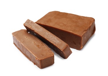 Photo of Pieces of tasty chocolate butter isolated on white