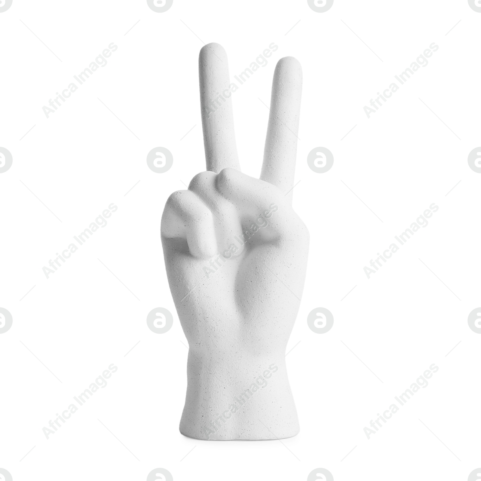 Decorative figure in shape of hand making V-sign isolated on white Photo of Decorative figure in shape of hand making V-sign isolated on white