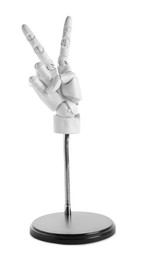 Photo of Mannequin hand on stand showing V-sign against white background