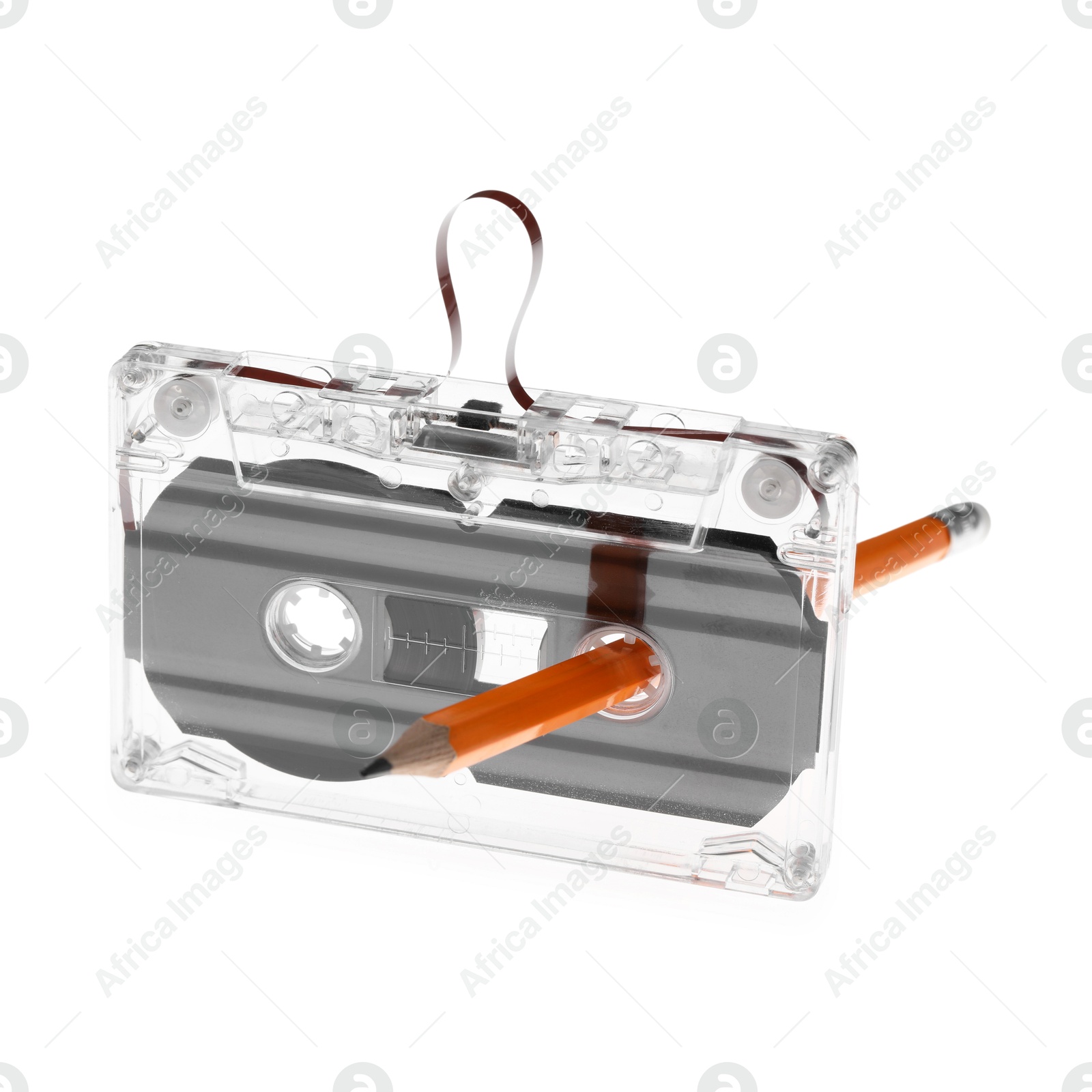 Rewinding audio cassette with pencil isolated on white Photo of Rewinding audio cassette with pencil isolated on white