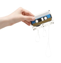 Photo of Woman holding audio cassette with blank label on white background, closeup