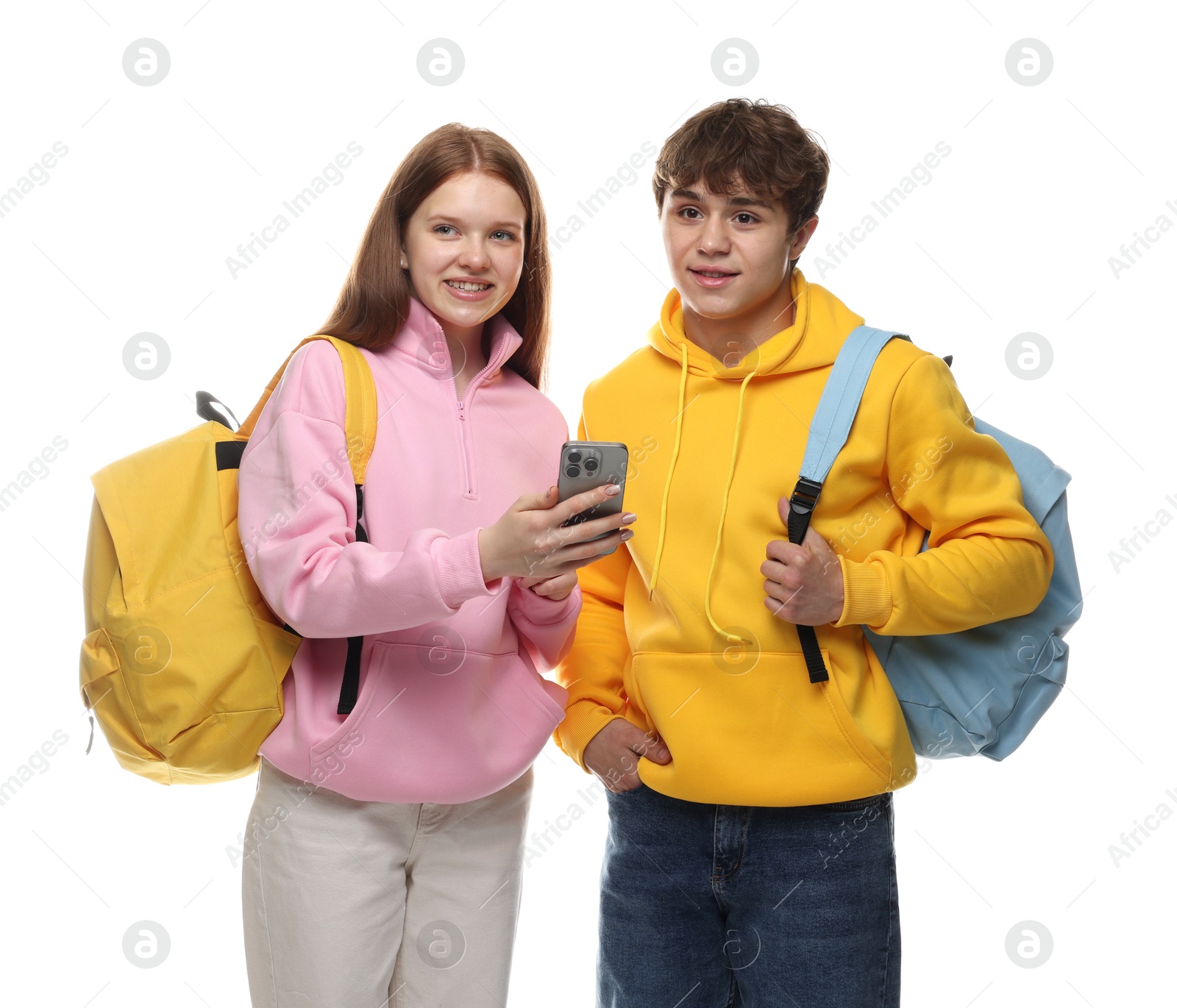 Photo of Teenage girl showing her friend something on smartphone against white background