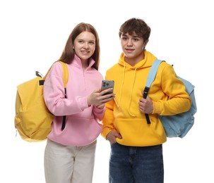 Photo of Teenage girl showing her friend something on smartphone against white background