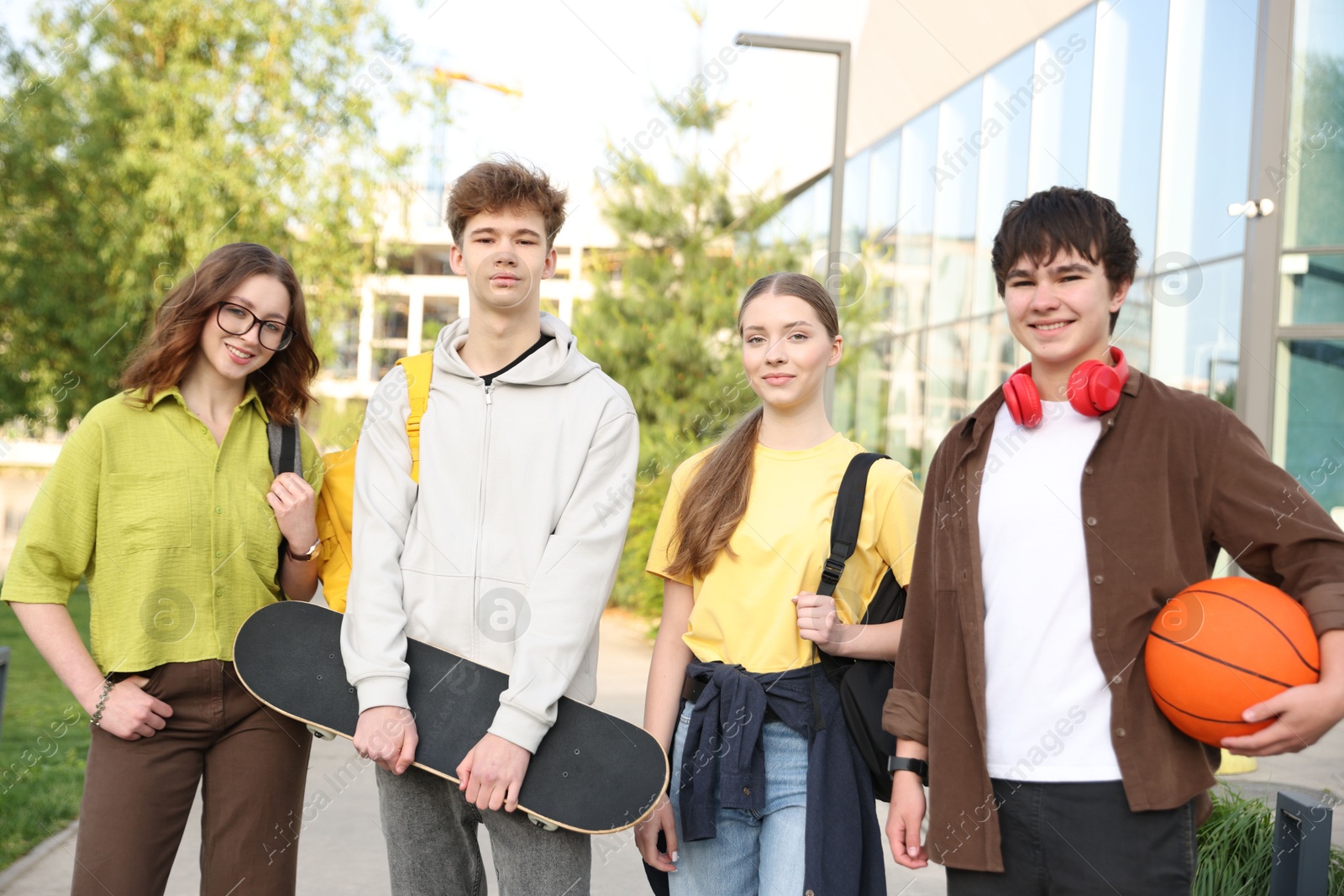 Photo of Group of teenagers spending time together outdoors