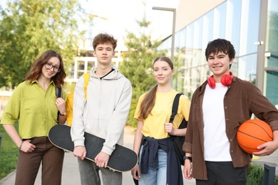 Photo of Group of teenagers spending time together outdoors