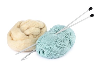 Photo of Felting wool, knitting yarn and needles isolated on white