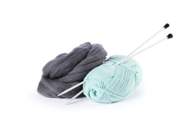 Photo of Felting wool, knitting yarn and needles isolated on white