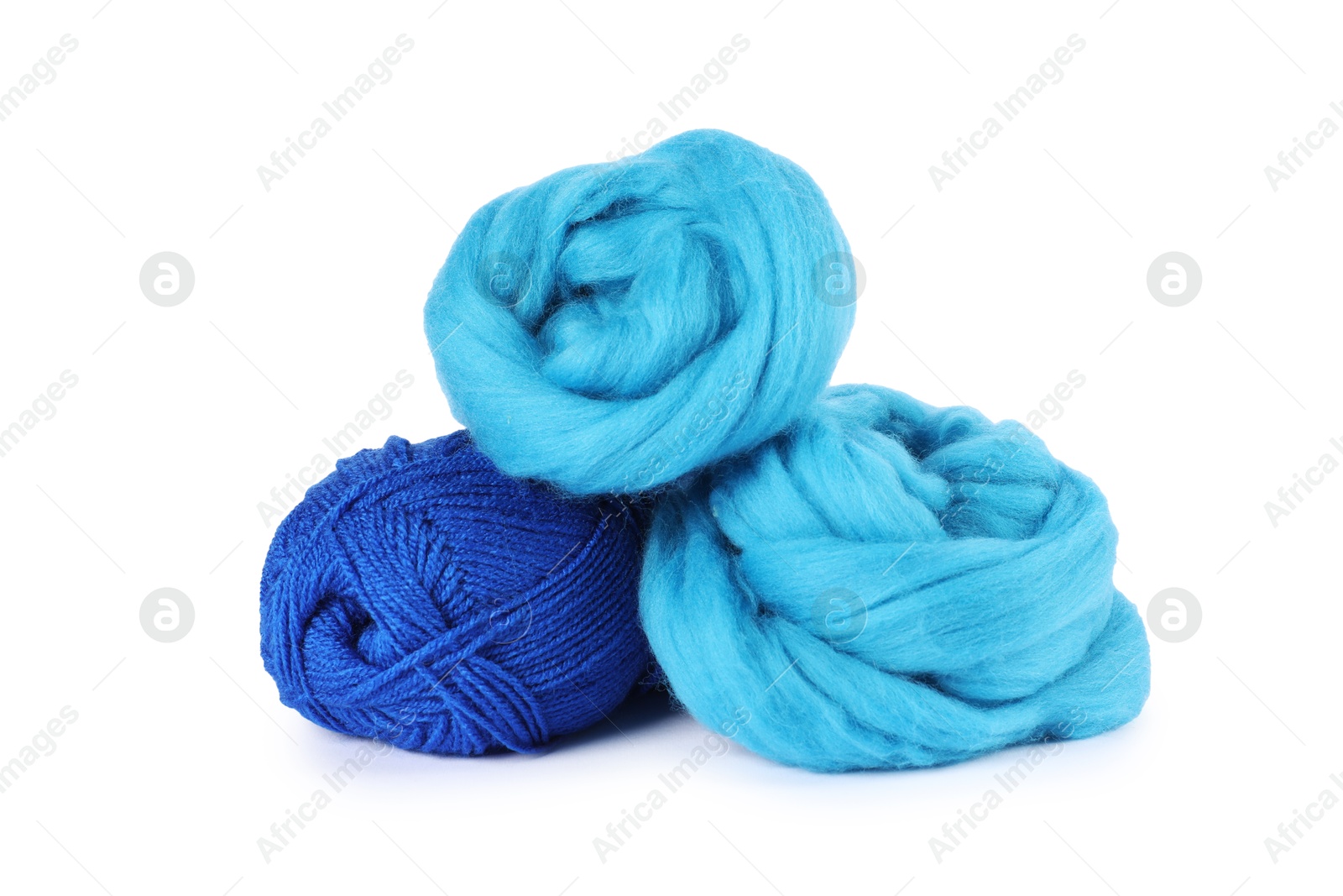 Felting wool and knitting yarn isolated on white Photo of Felting wool and knitting yarn isolated on white