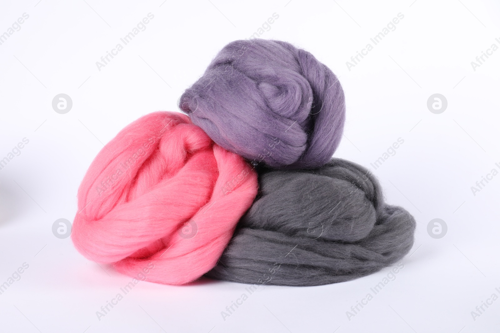 Different color felting wool isolated on white Photo of Different color felting wool isolated on white