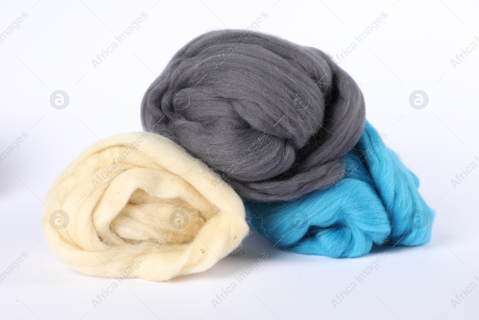 Different color felting wool isolated on white Photo of Different color felting wool isolated on white