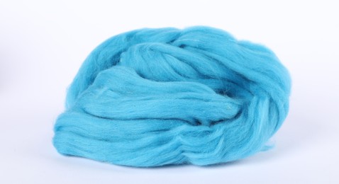 Photo of Light blue felting wool on white background