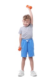 Photo of Little boy exercising with dumbbells on white background