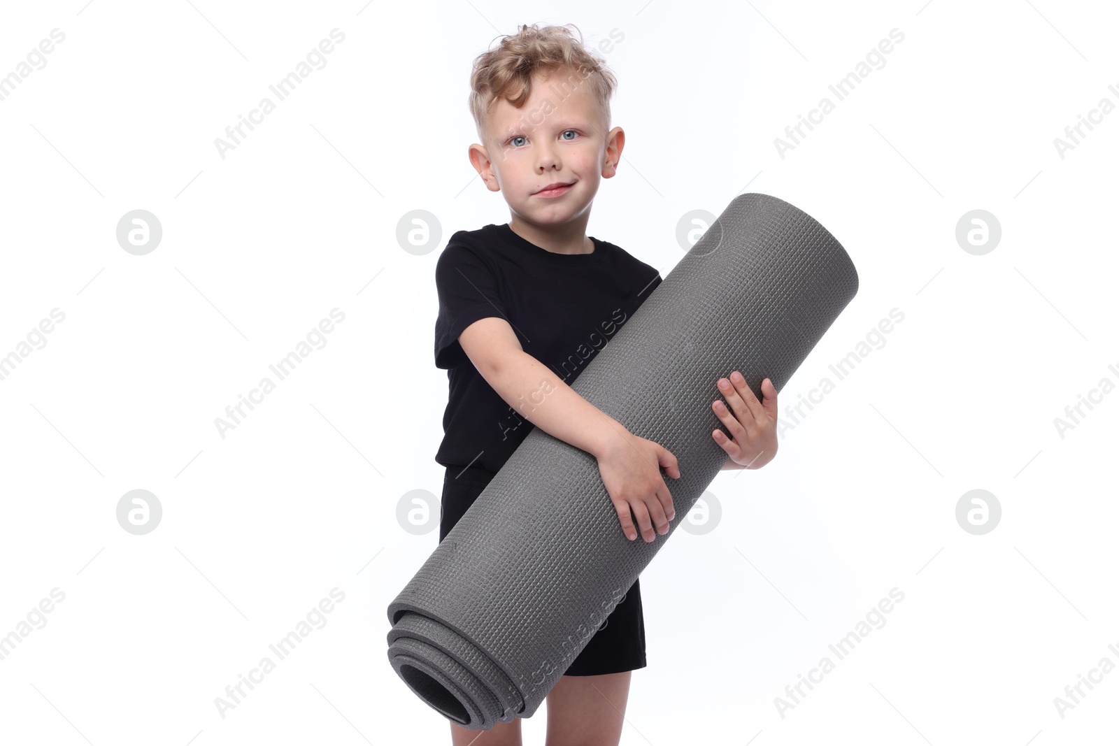 Little boy with yoga mat on white background Photo of Little boy with yoga mat on white background