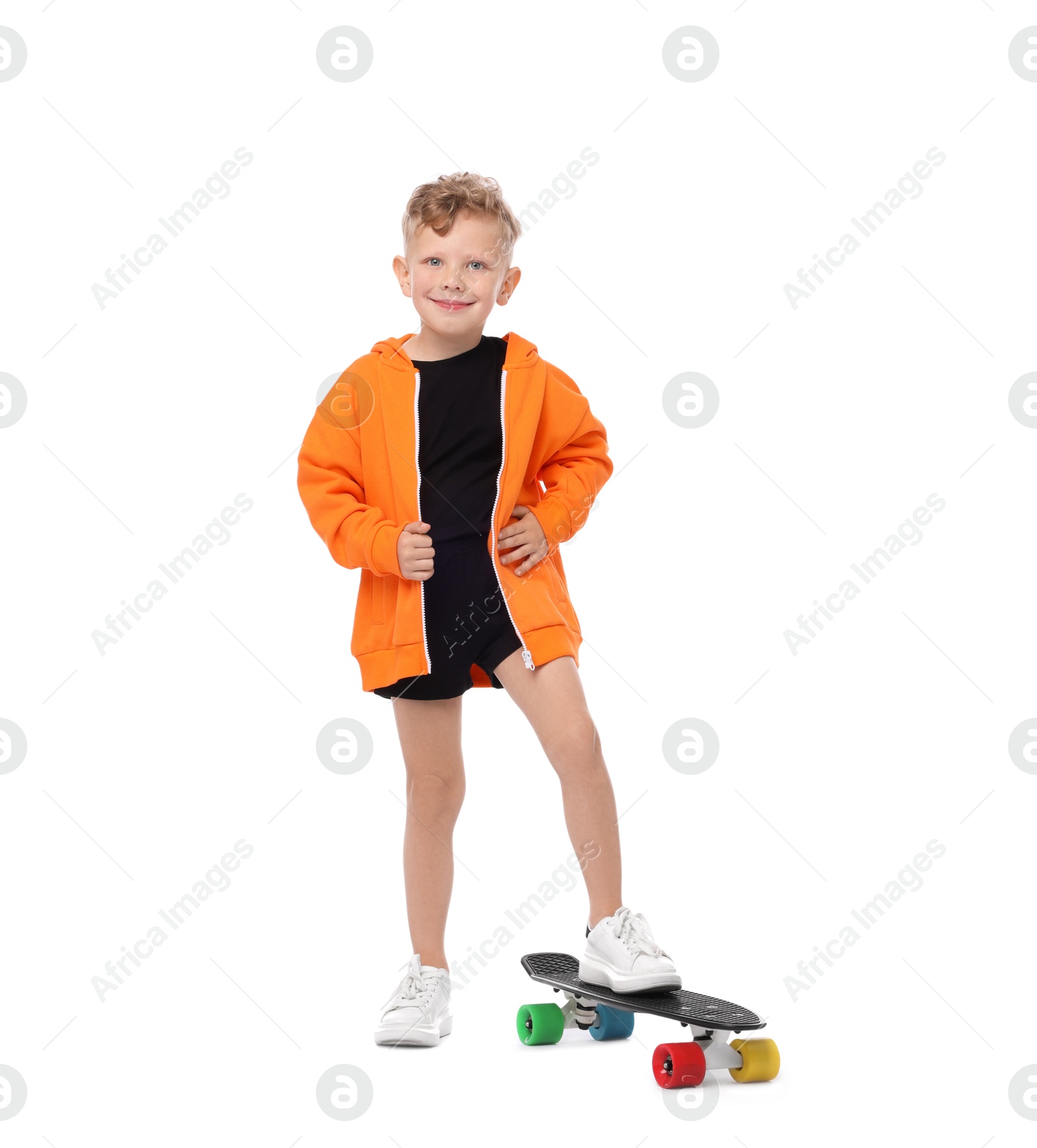 Little boy with penny board on white background Photo of Little boy with penny board on white background