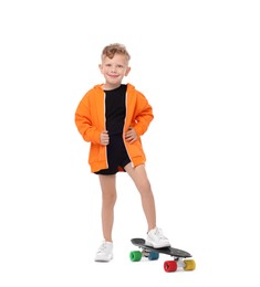 Photo of Little boy with penny board on white background